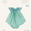 Pepa London Adelaide Floral Hand Smocked Sleeveless Dress With Bloomers in Green (3mths-3yrs) | Openwork Cotton Cardigan in Cream (6mths-10yrs) | Leather Mary Jane Pram Shoes in Ivory (17-20EU) | Adelaide Floral Small Bow Hair Clip in Green | Openwork short socks White (0mths-8yrs) | Flower Fairies of the Spring Book in White