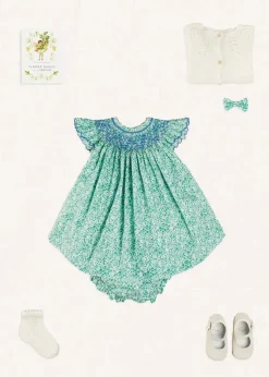 Pepa London Adelaide Floral Hand Smocked Sleeveless Dress With Bloomers in Green (3mths-3yrs) | Openwork Cotton Cardigan in Cream (6mths-10yrs) | Leather Mary Jane Pram Shoes in Ivory (17-20EU) | Adelaide Floral Small Bow Hair Clip in Green | Openwork short socks White (0mths-8yrs) | Flower Fairies of the Spring Book in White