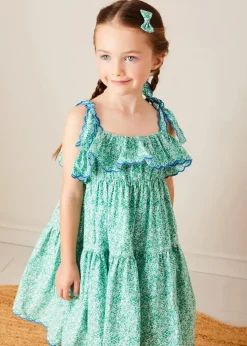 Pepa London Adelaide Floral Tiered Tie Strap Dress in Green (4-12yrs) | Plain Cardigan in Navy (6mths-10yrs) | Metallic Strappy Leather Sandals in Gold (24-35EU) | Adelaide Floral Detail Raffia Bag in Green | Adelaide Floral Small Bow Hair Clip in Green