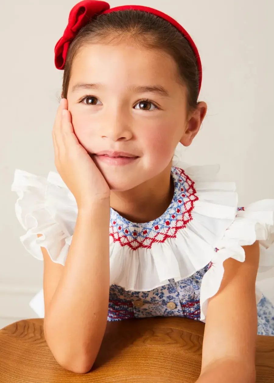 Pepa London Charlotte Floral Hand Smocked Sleeveless Dress in Blue (12mths-10yrs) | Openwork Cotton Cardigan in Cream (6mths-10yrs) | Girls Ivory Leather Mary Jane Shoes (20-34EU) | Plain Linen Hairband in Red | Openwork short socks White (0mths-8yrs)