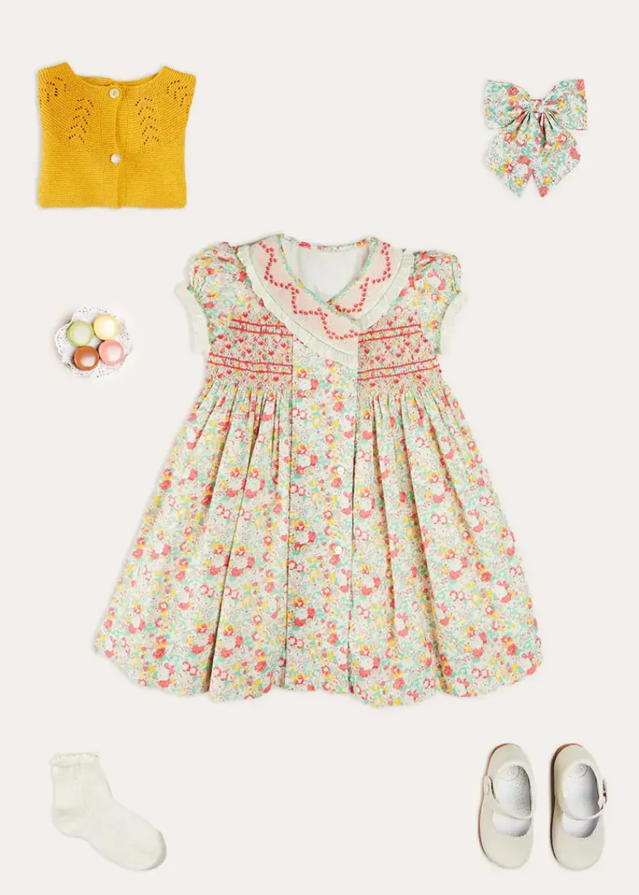 Pepa London Clementine Floral Hand Smocked Double Breasted Short Sleeve Dress in Coral (12mths-10yrs) | Mary Jane Leather Baby Shoes in Ivory (20-24EU) | Clementine Floral Long Bow Hair Clip in Coral | Openwork short socks White (0mths-8yrs)