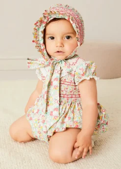 Pepa London Clementine Floral Hand Smocked Double Breasted Short Sleeve Romper in Coral (6mths-3yrs) | Clementine Floral Hand Smocked Bonnet in Coral (S-M) | Openwork Cotton Cardigan in Cream (6mths-10yrs) | Leather Mary Jane Pram Shoes in Ivory (17-20EU) | Openwork short socks White (0mths-8yrs)