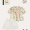 Pepa London Clementine Floral Smock Detail Short Sleeve Blouse in Coral (2-12yrs) | Scallop Trim Embroidered Shorts in White (2-10yrs) | Clementine Floral Quilted Reversible Jacket in Coral (4-12yrs) | Floral Openwork Cotton Cardigan in Pink (2-10yrs) | Linen Ballerina Shoes in Ivory (24-36EU) | Clementine Floral Long Bow Hair Clip in Coral | Little People, Big Dreams - Frida Kahlo Book in Green