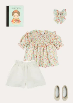 Pepa London Clementine Floral Smock Detail Short Sleeve Blouse in Coral (2-12yrs) | Scallop Trim Embroidered Shorts in White (2-10yrs) | Clementine Floral Quilted Reversible Jacket in Coral (4-12yrs) | Floral Openwork Cotton Cardigan in Pink (2-10yrs) | Linen Ballerina Shoes in Ivory (24-36EU) | Clementine Floral Long Bow Hair Clip in Coral | Little People, Big Dreams - Frida Kahlo Book in Green