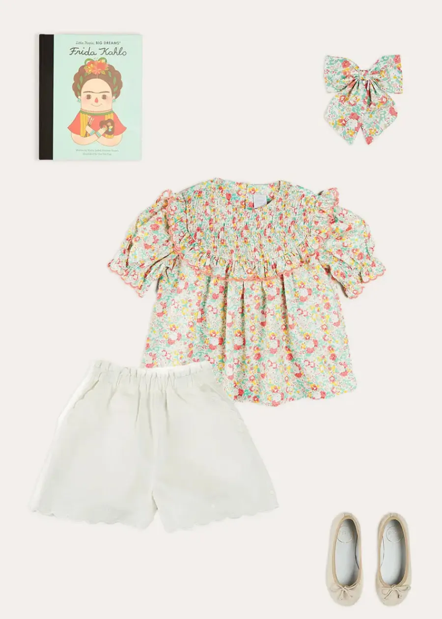 Pepa London Clementine Floral Smock Detail Short Sleeve Blouse in Coral (2-12yrs) | Scallop Trim Embroidered Shorts in White (2-10yrs) | Clementine Floral Quilted Reversible Jacket in Coral (4-12yrs) | Floral Openwork Cotton Cardigan in Pink (2-10yrs) | Linen Ballerina Shoes in Ivory (24-36EU) | Clementine Floral Long Bow Hair Clip in Coral | Little People, Big Dreams - Frida Kahlo Book in Green