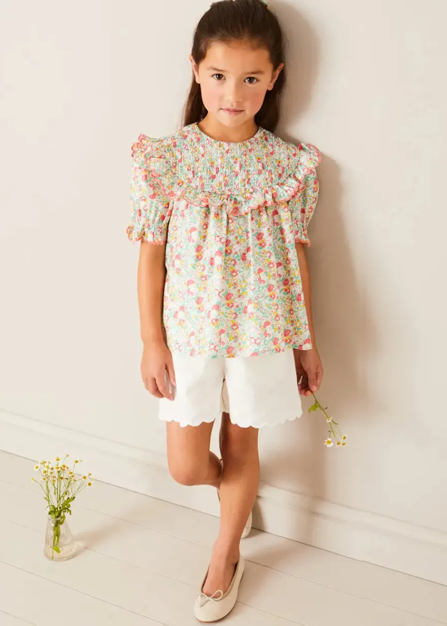Pepa London Clementine Floral Smock Detail Short Sleeve Blouse in Coral (2-12yrs) | Scallop Trim Embroidered Shorts in White (2-10yrs) | Clementine Floral Quilted Reversible Jacket in Coral (4-12yrs) | Floral Openwork Cotton Cardigan in Pink (2-10yrs) | Linen Ballerina Shoes in Ivory (24-36EU) | Clementine Floral Long Bow Hair Clip in Coral | Little People, Big Dreams - Frida Kahlo Book in Green