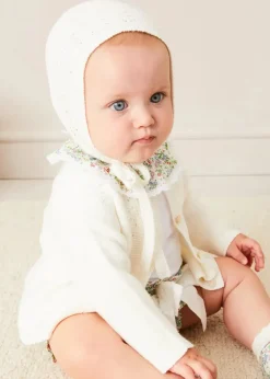 Pepa London Cordelia Embroidered Double Collar Bodysuit in Pink Made with Liberty Fabric (1m-3yrs) | Cordelia Floral Bloomer with Bow in Pink Made with Liberty Fabric (1m-2yrs) | Openwork Cotton Cardigan in Cream (6mths-10yrs) | Openwork Cotton Knitted Bonnet in Cream (S-L) | Cordelia Liberty Floral Mary Jane Pram Shoes in Pink (17-20EU) | Cordelia Liberty Floral Dummy Clip in Pink | Openwork short socks White (0mths-8yrs) | BIBS Dummy in Pink