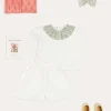 Pepa London Cordelia Floral Collar Top in Pink Made with Liberty Fabric (2-10yrs) | Scallop Trim Embroidered Shorts in White (2-10yrs) | Floral Openwork Cotton Cardigan in Pink (2-10yrs) | Canvas Plimsolls in Cream (20-35EU) | Cordelia Floral Medium Bow Clip in Pink Made with Liberty Fabric | The Tale Of Kitty In Boots Book in White