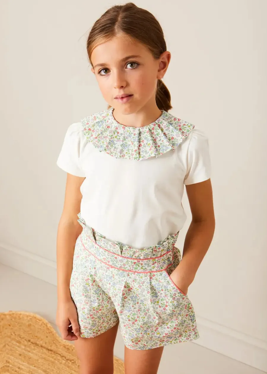 Pepa London Cordelia Floral Collar Top in Pink Made with Liberty Fabric (2-10yrs) | Cordelia Floral Shorts in Pink Made with Liberty Fabric (4-10yrs) | Floral Openwork Cotton Cardigan in Pink (2-10yrs) | Canvas Plimsolls in Cream (20-35EU) | Cordelia Floral Medium Bow Clip in Pink Made with Liberty Fabric