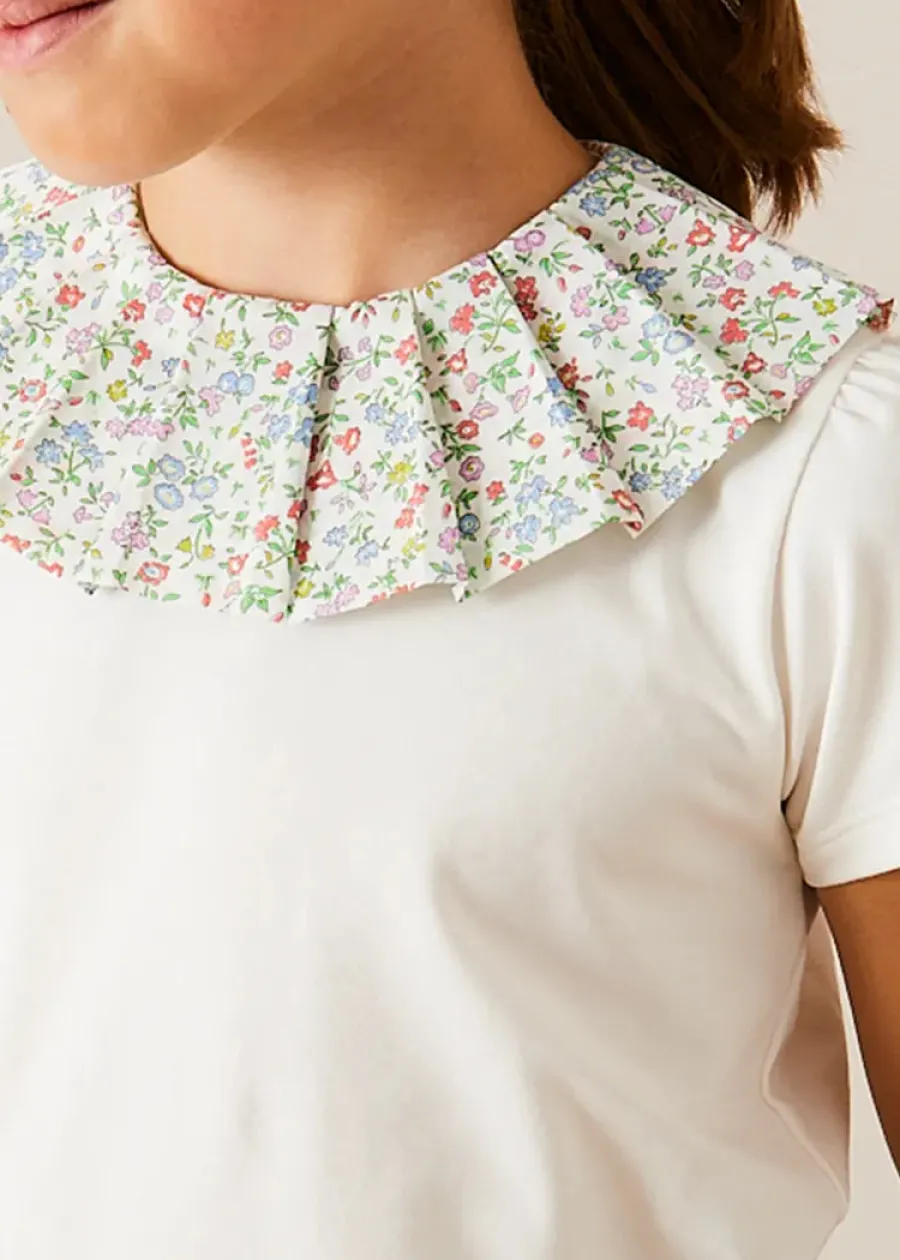 Pepa London Cordelia Floral Collar Top in Pink Made with Liberty Fabric (2-10yrs) | Cordelia Floral Shorts in Pink Made with Liberty Fabric (4-10yrs) | Floral Openwork Cotton Cardigan in Pink (2-10yrs) | Canvas Plimsolls in Cream (20-35EU) | Cordelia Floral Medium Bow Clip in Pink Made with Liberty Fabric