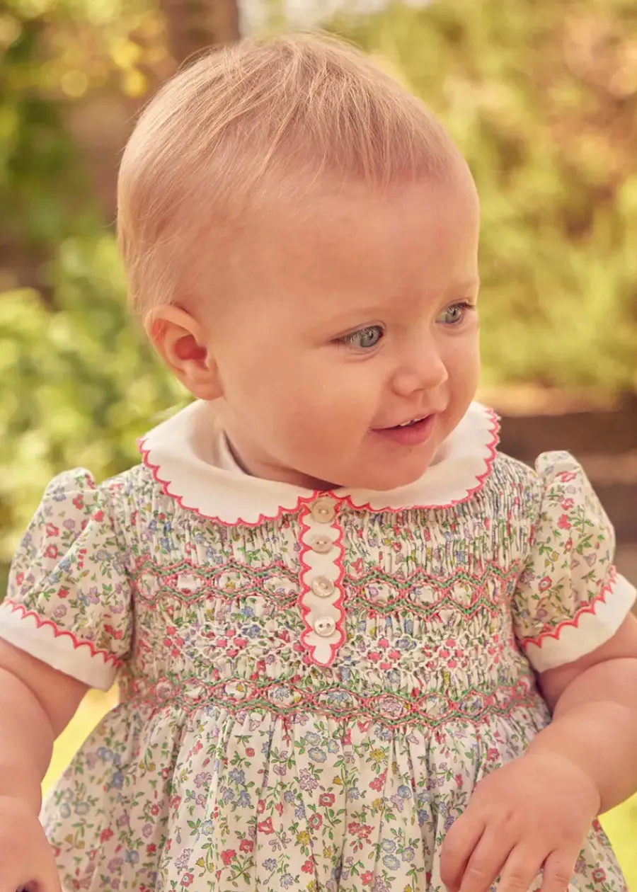 Pepa London Cordelia Floral Hand-Smocked Short Sleeve Romper in Pink Made with Liberty Fabric (3m-2yrs)