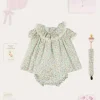 Pepa London Cordelia Floral Ruffle Collar Short Sleeve Dress in Green Made with Liberty Fabric (1-12m) | Openwork Detail Baby Cardigan in Pink (1-12mths) | Lace Detail Knitted Bonnet in Pink (1-12mths) | Lace Detail Knitted Booties in Pink | Cordelia Liberty Floral Dummy Clip in Pink | Openwork short socks White (0mths-8yrs) | BIBS Dummy in Pink