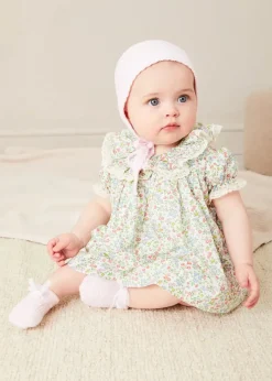 Pepa London Cordelia Floral Ruffle Collar Short Sleeve Dress in Green Made with Liberty Fabric (1-12m) | Openwork Detail Baby Cardigan in Pink (1-12mths) | Lace Detail Knitted Bonnet in Pink (1-12mths) | Lace Detail Knitted Booties in Pink | Cordelia Liberty Floral Dummy Clip in Pink | Openwork short socks White (0mths-8yrs) | BIBS Dummy in Pink
