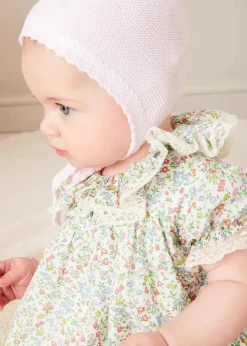 Pepa London Cordelia Floral Ruffle Collar Short Sleeve Dress in Green Made with Liberty Fabric (1-12m) | Openwork Detail Baby Cardigan in Pink (1-12mths) | Lace Detail Knitted Bonnet in Pink (1-12mths) | Lace Detail Knitted Booties in Pink | Cordelia Liberty Floral Dummy Clip in Pink | Openwork short socks White (0mths-8yrs) | BIBS Dummy in Pink