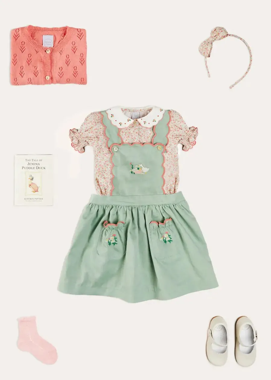 Pepa London Duck Embroidered Scallop Detail Skirt With Braces in Green (18mths-6yrs) | Mabel Floral Embroidered Short Sleeve Blouse in Coral (18mths-10yrs) | Floral Openwork Cotton Cardigan in Pink (2-10yrs) | Mary Jane Leather Baby Shoes in Ivory (20-24EU) | Mabel Floral Hairband in Coral | Openwork short socks - Dusty Pink (0mths-10yrs)