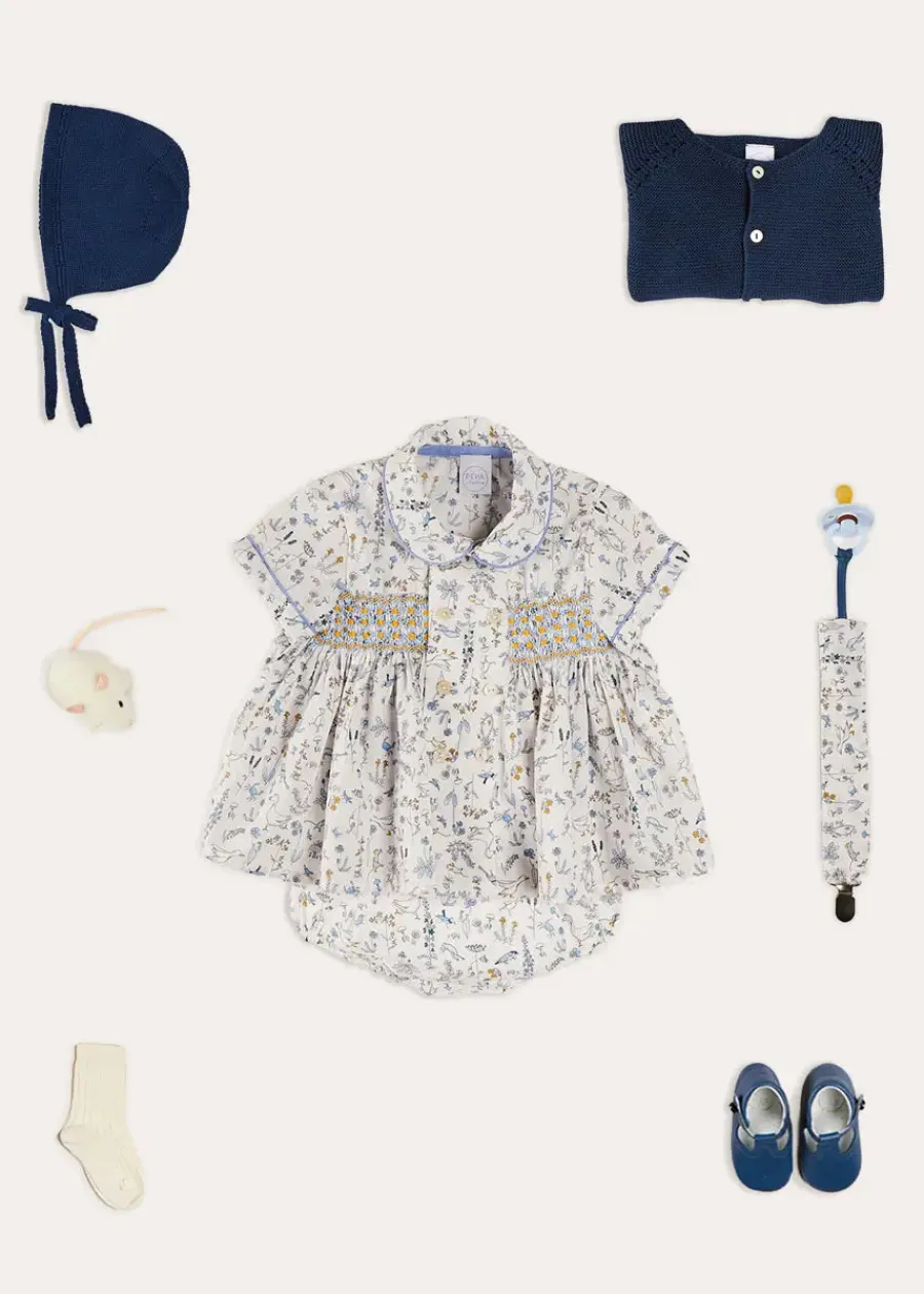 BOY Pepa London Ellis Liberty Print Hand Smocked Short Sleeve Shirt in Blue (6mths-4yrs) | Ellis Floral Bloomer in Blue Made with Liberty Fabric (1m-3yrs) | Plain Cardigan in Navy (6mths-10yrs) | Openwork Knitted Bonnet in Navy (S-L) | Leather T-Bar Pram Shoes in Classic Blue (17-20EU) | Ribbed Short Socks - Cream (0mths-10yrs)