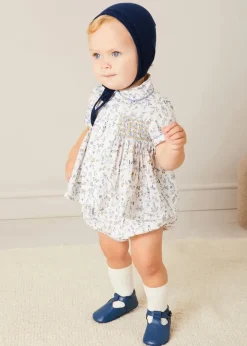 BOY Pepa London Ellis Liberty Print Hand Smocked Short Sleeve Shirt in Blue (6mths-4yrs) | Ellis Floral Bloomer in Blue Made with Liberty Fabric (1m-3yrs) | Plain Cardigan in Navy (6mths-10yrs) | Openwork Knitted Bonnet in Navy (S-L) | Leather T-Bar Pram Shoes in Classic Blue (17-20EU) | Ribbed Short Socks - Cream (0mths-10yrs)