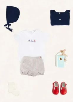 BOY Pepa London Embroidered Boat Motif Peter Pan Collar Bodysuit in White (1mth-3yrs) | Beaufort Striped Button Detail Bloomers in Red (3mths-3yrs) | Plain Cardigan in Navy (6mths-10yrs) | Openwork Knitted Bonnet in Navy (S-L) | T-Bar Pram Shoes in Red (17-20EU) | Ribbed Short Socks - Cream (0mths-10yrs)