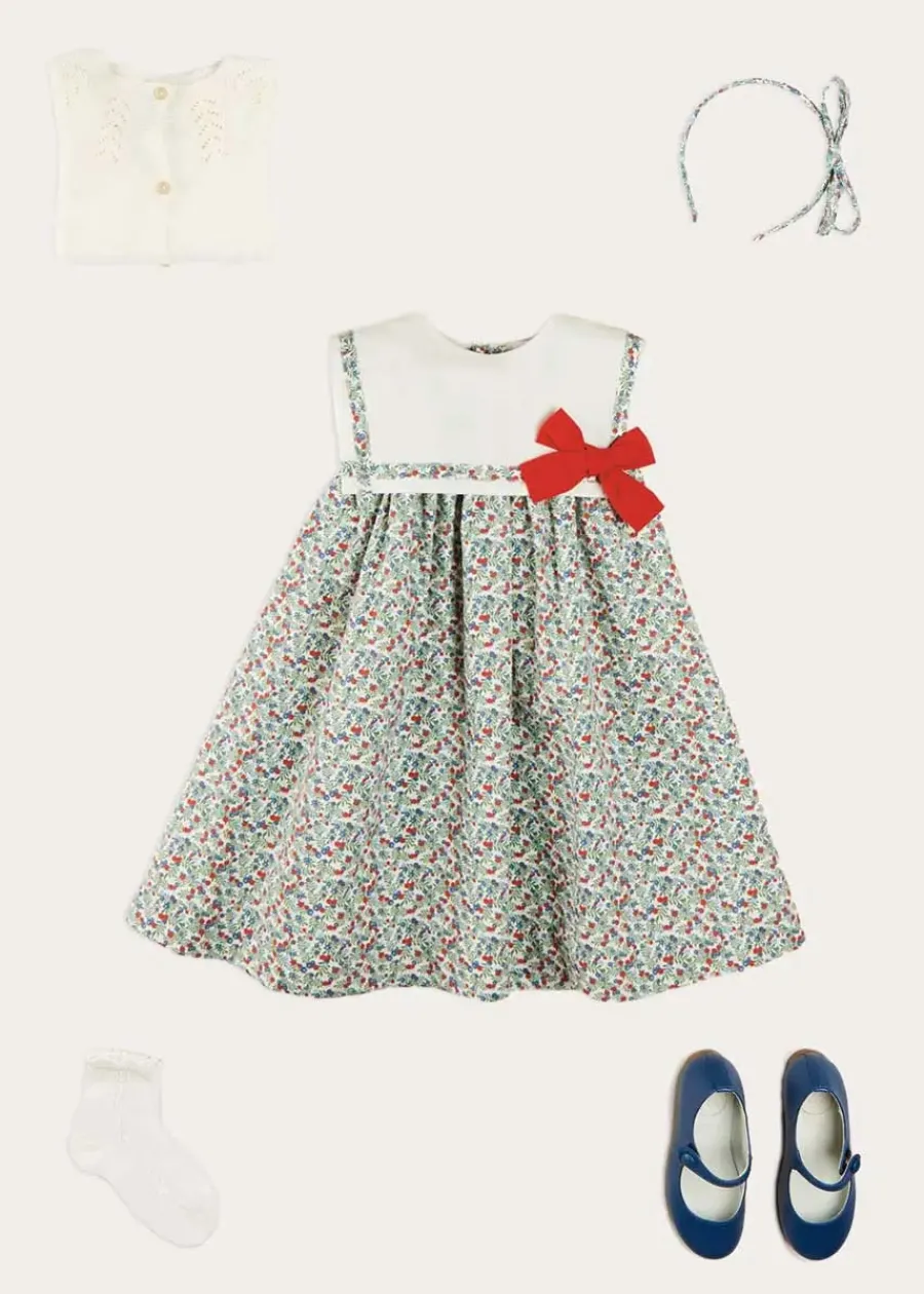 Pepa London Evelyn Floral Sleeveless Bow Detail Trapeze Dress in Red (12mths-8yrs) | Openwork Cotton Cardigan in Cream (6mths-10yrs) | Evelyn Floral Thin Bow Hairband in Red | Openwork short socks White (0mths-8yrs)