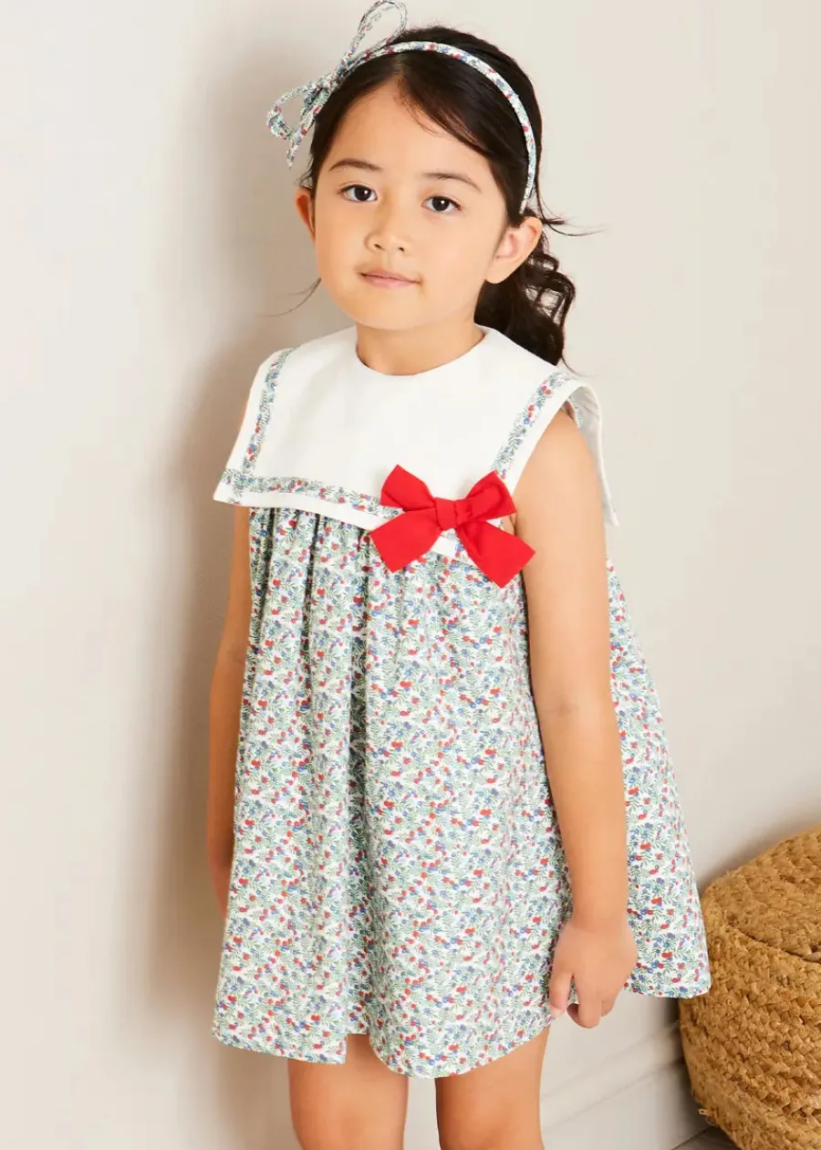 Pepa London Evelyn Floral Sleeveless Bow Detail Trapeze Dress in Red (12mths-8yrs) | Openwork Cotton Cardigan in Cream (6mths-10yrs) | Evelyn Floral Thin Bow Hairband in Red | Openwork short socks White (0mths-8yrs)