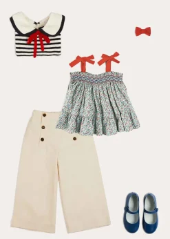 Pepa London Evelyn Floral Smock Detail Tie Strap Blouse in Red (4-10yrs) | Wide Leg Front Button Trousers in Beige (2-10yrs) | Mariner Collar Bold Stripe Jumper in White (2-10yrs) | Plain Linen Small Bow Hair Clip in Red