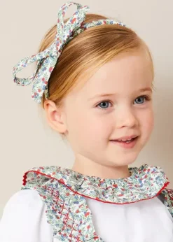 Pepa London Evelyn Floral Smocked Detail Skirt With Braces in Red (18mths-6yrs) | Evelyn Floral Ruffle Collar Top in Red (2-10yrs) | Statement Collar Floral Embroidery Cardigan in Navy (2-10yrs) | Leather Mary Jane Baby Shoes in French Blue (20-26EU) | Evelyn Floral Thin Bow Hairband in Red | Ribbed Shorts Socks Red (0mths-10yrs)