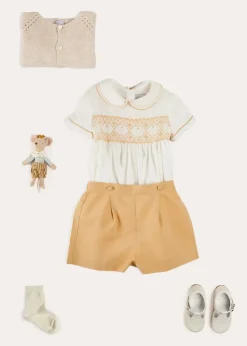 BOY Pepa London Hand Smocked Peter Pan Collar Short Sleeve Two Piece Set in Beige (18mths-6yrs) | Plain Cardigan in Cream (6mths-10yrs) | T-Bar Leather Baby Shoes in Ivory (20-24EU) | Cotton Short Socks Cream (0mths-10yrs)