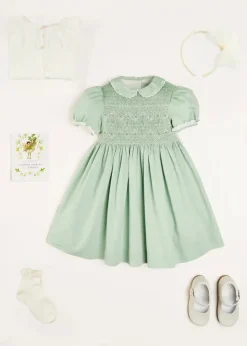 Pepa London Hand Smocked Peter Pan Collar Short Sleeve Dress in Green (12mths-10yrs) | Openwork Cotton Cardigan in Cream (6mths-10yrs) | Girls Ivory Leather Mary Jane Shoes (20-34EU) | Traditional Big Bow Tulle Hairband in Ivory | Flower Fairies of the Spring Book in White | Openwork short socks White (0mths-8yrs)
