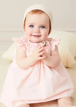 Pepa London Hand Smocked Sleeveless Dress With Bloomers in Pink (1-12mths) | Openwork Detail Baby Cardigan in Pink (1-12mths) | Openwork Knitted Bonnet in Beige(S-L) | Cordelia Liberty Floral Mary Jane Pram Shoes in Pink (17-20EU) | Cordelia Liberty Floral Dummy Clip in Pink | Knitted Bunny Teether in Beige | BIBS Dummy in Pink