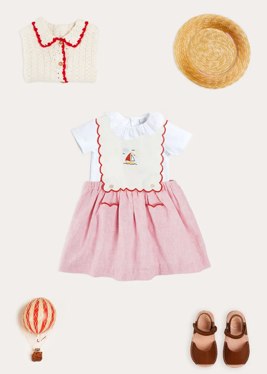Pepa London Lawrence Striped Boat Embroidered Scallop Detail Pinafore Skirt in Red (18mths-4yrs) | Cherry Motif Crochet Cardigan in Beige (2-10yrs) | Piculina Trim Top in White (2-10yrs) | Open Toe Leather Sandals in Brown (17-30EU)