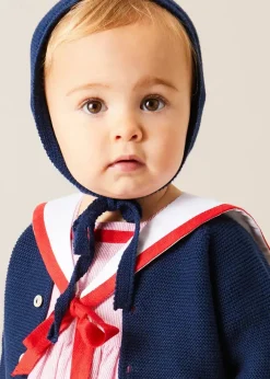Pepa London Lawrence Striped Mariner Collar Short Sleeve Romper in Red (6mths-3yrs) | Openwork Knitted Bonnet in Navy (S-L) | Plain Cardigan in Navy (6mths-10yrs) | Leather Mary Jane Pram Shoes in Red (17-20EU) | Openwork short socks White (0mths-8yrs)