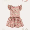Pepa London Margot Floral Sleeveless Hand-Smocked Dress in Red Made with Liberty Fabric (4-12yrs) | Openwork Cotton Cardigan in Cream (6mths-10yrs) | Girls Ivory Leather Mary Jane Shoes (20-34EU) | Margot Liberty Floral Scrunchie Hairband in Red | Openwork short socks White (0mths-8yrs)
