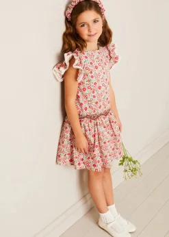 Pepa London Margot Floral Sleeveless Hand-Smocked Dress in Red Made with Liberty Fabric (4-12yrs) | Openwork Cotton Cardigan in Cream (6mths-10yrs) | Girls Ivory Leather Mary Jane Shoes (20-34EU) | Margot Liberty Floral Scrunchie Hairband in Red | Openwork short socks White (0mths-8yrs)