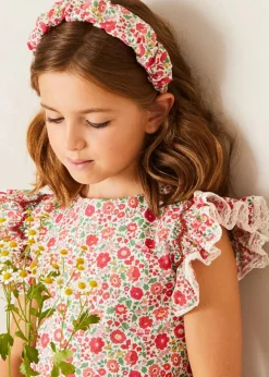 Pepa London Margot Floral Sleeveless Hand-Smocked Dress in Red Made with Liberty Fabric (4-12yrs) | Openwork Cotton Cardigan in Cream (6mths-10yrs) | Girls Ivory Leather Mary Jane Shoes (20-34EU) | Margot Liberty Floral Scrunchie Hairband in Red | Openwork short socks White (0mths-8yrs)