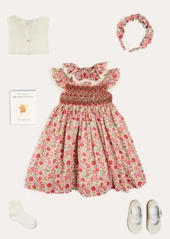 Pepa London Margot Hand-Smocked Dress in Red Made with Liberty Fabric (12m-6yrs) | Openwork Cotton Cardigan in Cream (6mths-10yrs) | Mary Jane Leather Baby Shoes in Ivory (20-24EU) | Margot Liberty Floral Scrunchie Hairband in Red | Openwork short socks White (0mths-8yrs)