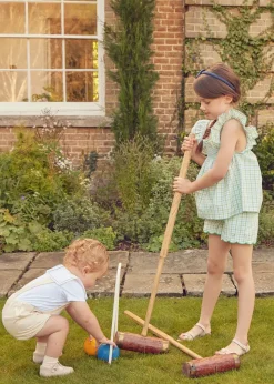Pepa London Maxwell Gingham Smock Detail Blouse in Green (5-10yrs) | Maxwell Gingham Scallop Trim Embroidered Shorts in Green (18mths-10yrs) | Floral Openwork Cotton Cardigan in Green (2-10yrs) | Leather Woven Detail Sandals in Beige (24-35EU) | Navy Linen Big Bow Hairband | Flower Fairies of the Spring Book in White