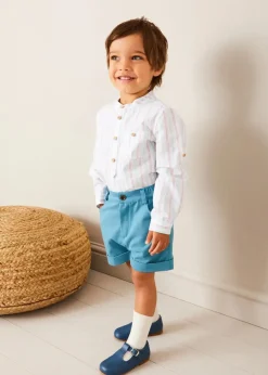 BOY Pepa London Nautical Boat Embroidery Polo Collar Cardigan in Blue (12mths-6yrs) | Chesham Striped Mao Collar Long Sleeve Shirt in Red (3-10yrs) | Plain Elasticated Shorts in Blue (12mths-4yrs) | T-Bar Baby Shoes in Blue (20-26EU) | Ribbed Short Socks in Beige (0mths-10yrs)