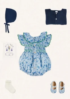 Pepa London Olivia Floral Smocked Ruffle Collar Sleeveless Romper in Blue (6mths-2yrs) | Plain Cardigan in Navy (6mths-10yrs) | Openwork Knitted Bonnet in Navy (S-L) | Olivia Floral Mary Jane Pram Shoes in Blue (17-20EU) | Openwork short socks White (0mths-8yrs) | Flower Fairies of the Summer Book in White