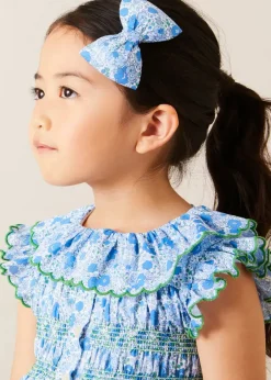 Pepa London Olivia Floral Smocked Ruffle Collar Sleeveless Dress in Blue (12mths-10yrs) | Floral Openwork Cotton Cardigan in Green (2-10yrs) | Leather Woven Detail Sandals in Beige (24-35EU) | Olivia Floral Medium Bow Hair Clip in Blue