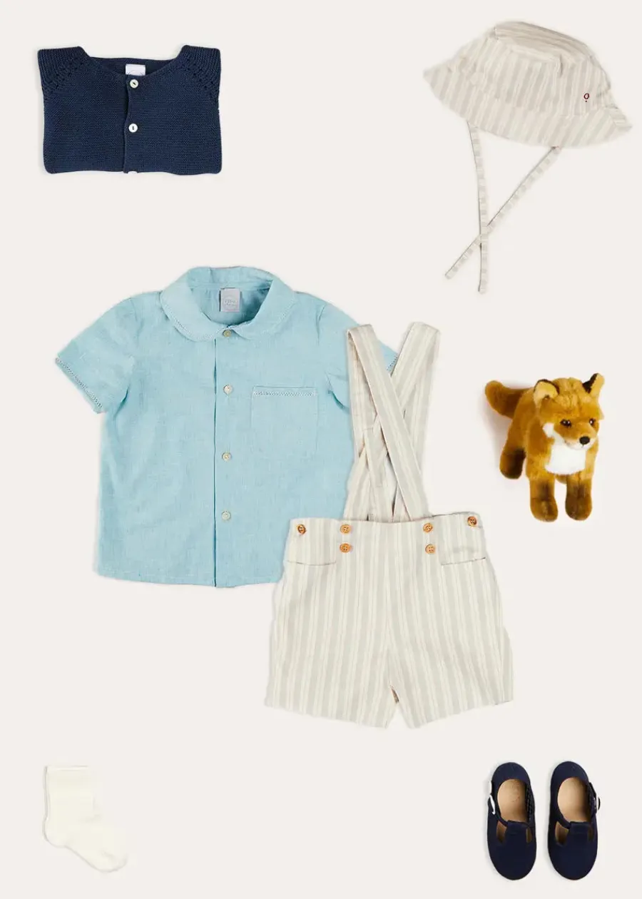 BOY Pepa London Peter Pan Collar Trim Detail Short Sleeve Shirt in Blue (12mths-5yrs) | Brompton Striped Shorts With Braces in Beige (12mths-4yrs) | Plain Cardigan in Navy (6mths-10yrs) | Woven T-Bar Baby Shoes in Navy (20-26EU) | Brompton Striped Sun Hat in Beige (XS-M) | Ribbed Short Socks - Cream (0mths-10yrs)