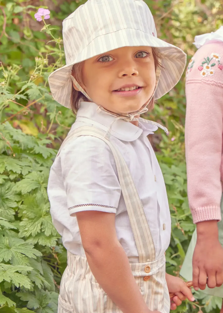 BOY Pepa London Peter Pan Collar Trim Detail Short Sleeve Shirt in White (12mths-5yrs) | Brompton Striped Shorts With Braces in Beige (12mths-4yrs) | T-Bar Leather Baby Shoes in Ivory (20-24EU) | Brompton Striped Sun Hat in Beige (XS-M) | Ribbed Short Socks in Beige (0mths-10yrs)