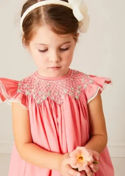 Pepa London Plain Hand Smocked Sleeveless Dress in Coral (12mths-10yrs) | Plain Cardigan in Cream (6mths-10yrs) | Girls Ivory Leather Mary Jane Shoes (20-34EU) | Traditional Big Bow Tulle Hairband in Ivory | Openwork short socks White (0mths-8yrs)