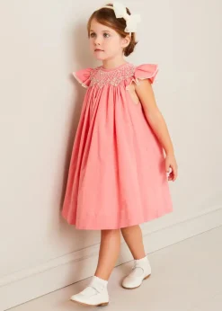 Pepa London Plain Hand Smocked Sleeveless Dress in Coral (12mths-10yrs) | Plain Cardigan in Cream (6mths-10yrs) | Girls Ivory Leather Mary Jane Shoes (20-34EU) | Traditional Big Bow Tulle Hairband in Ivory | Openwork short socks White (0mths-8yrs)