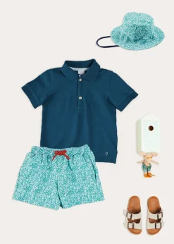 BOY Pepa London Plain Short Sleeve Polo Shirt in Navy (2-10yrs) | Adelaide Floral Tie Detail Swim Shorts in Green (2-10yrs) | Suede Buckle Detail Sandals in Beige (28-35EU) | Adelaide Floral Beach Hat in Green (S-M) | Big Brother Beach Mouse Toy