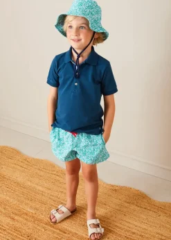 BOY Pepa London Plain Short Sleeve Polo Shirt in Navy (2-10yrs) | Adelaide Floral Tie Detail Swim Shorts in Green (2-10yrs) | Suede Buckle Detail Sandals in Beige (28-35EU) | Adelaide Floral Beach Hat in Green (S-M) | Big Brother Beach Mouse Toy