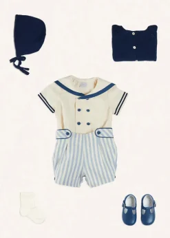 BOY Pepa London Regency Stripe Mariner Collar Two Piece Set With Bloomers in Blue (6mths-3yrs) | Plain Cardigan in Navy (6mths-10yrs) | Openwork Knitted Bonnet in Navy (S-L) | T-Bar Baby Shoes in Blue (20-26EU) | Cotton Short Socks Cream (0mths-10yrs) | Limited Edition Merrythought & Pepa Teddy Bear With Regency Striped Bow in Blue (S-L)