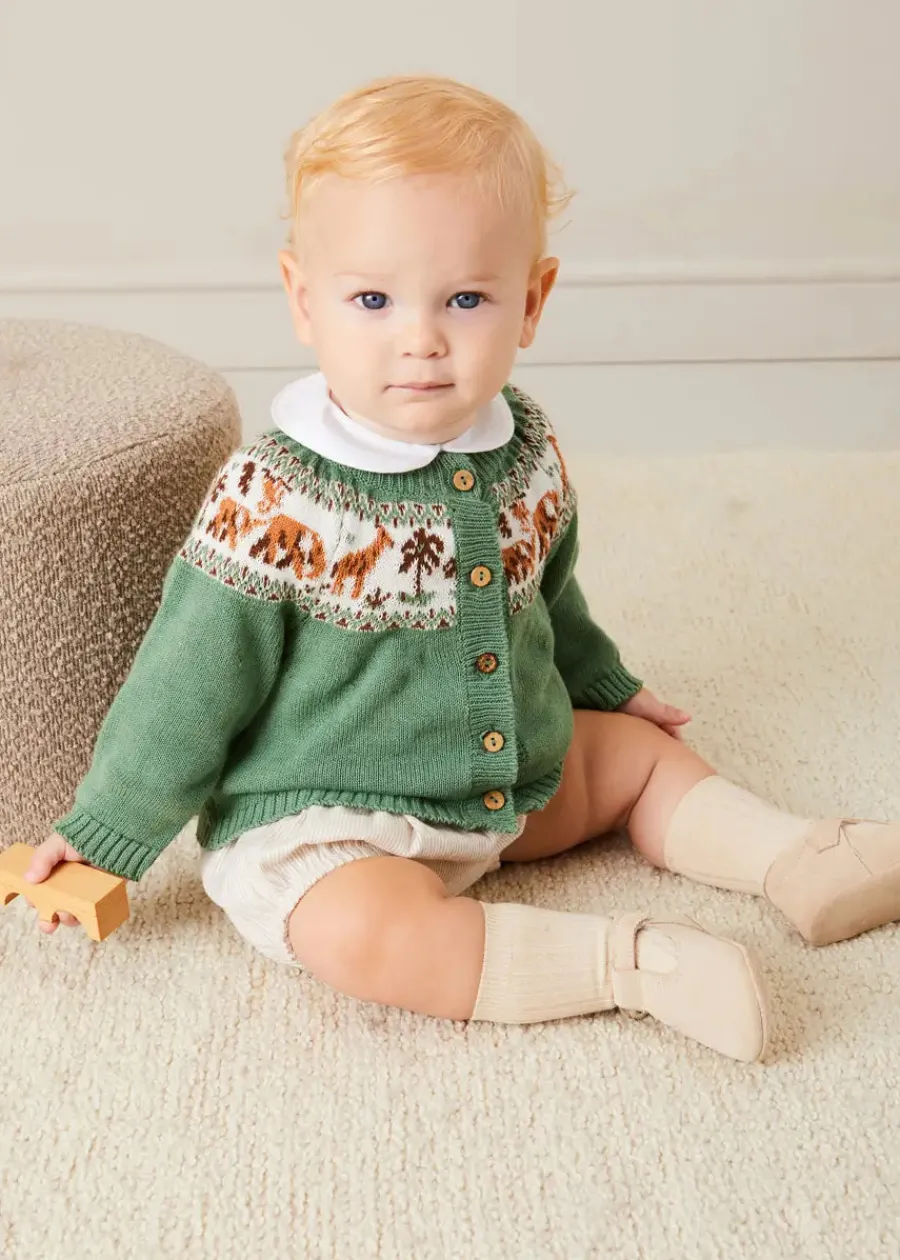 BOY Pepa London Safari Intarsia Cardigan in Green (6mths-6yrs) | Waterford Striped Polo Collar Short Sleeve Top in Beige (12mths-4yrs) | Striped Button Detail Bloomers in Beige (3mths-3yrs) | Suede T-Bar Pram Shoes in Beige (17-20EU) | Ribbed Short Socks in Beige (0mths-10yrs) | Little People, Big Dreams - David Attenborough Book in Green | Waterford Striped Dummy Clip in Beige | BIBS Dummy in Ivory