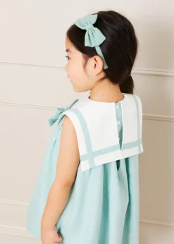 Pepa London Sleeveless Trapeze Dress With Bow Detail in Green (12mths-10yrs) | Green Linen Hairband | Mary Jane Leather Baby Shoes in Ivory (20-24EU) | Openwork short socks White (0mths-8yrs) | Chick Toy in Yellow
