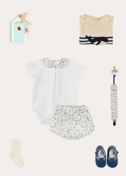 BOY Pepa London Whale Intarsia Striped Jumper in Blue (6mths-10yrs) | Ellis Short Sleeve Bodysuit with Printed Collar Made with Liberty Fabric (1m-2yrs) | Ellis Floral Bloomer in Blue Made with Liberty Fabric (1m-3yrs) | Leather T-Bar Pram Shoes in Classic Blue (17-20EU) | Ribbed Short Socks in Beige (0mths-10yrs) | Big Brother Beach Mouse Toy | Ellis Dummy Clip in Blue Made with Liberty Fabric | BIBS Dummy in Blue